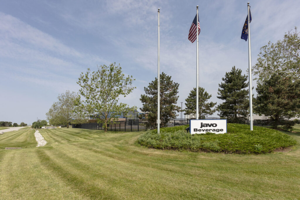 sign that is in the middle of a field