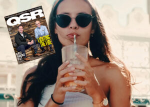 A woman wearing sunglasses enjoying a refreshing drink