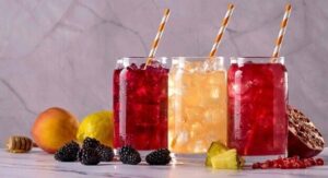ree glasses filled with different types of beverages