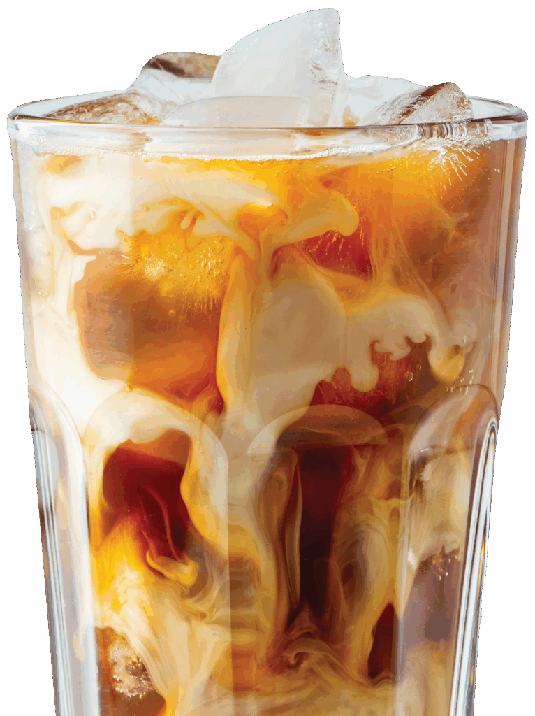 Glass of iced and refreshing cold brew coffee swirling with cream