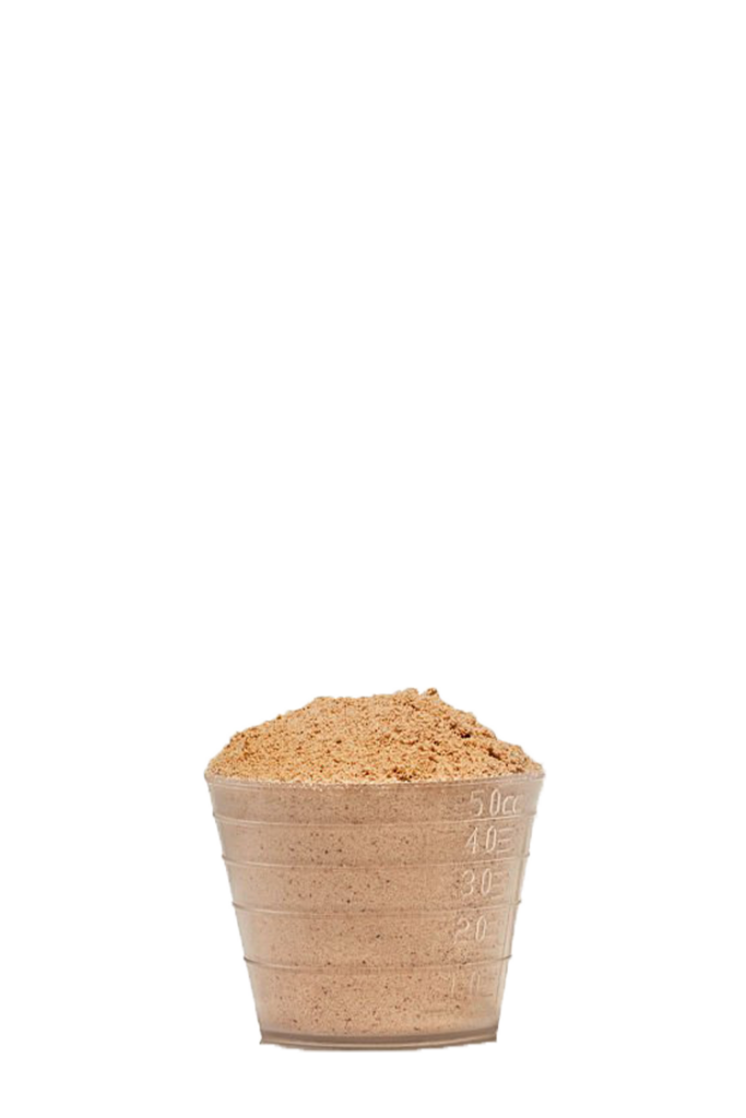a small cup filled with sand on a black background