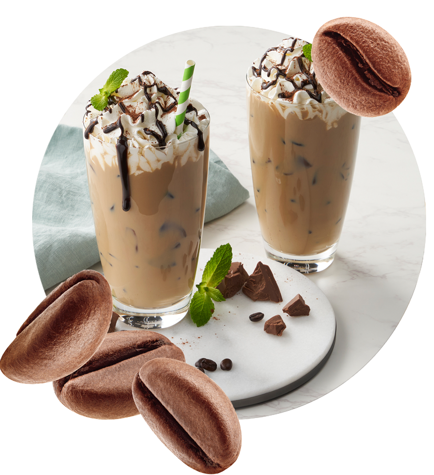 Cold brew espresso in a glass turned into a frappe drink with chocolate and whipped cream