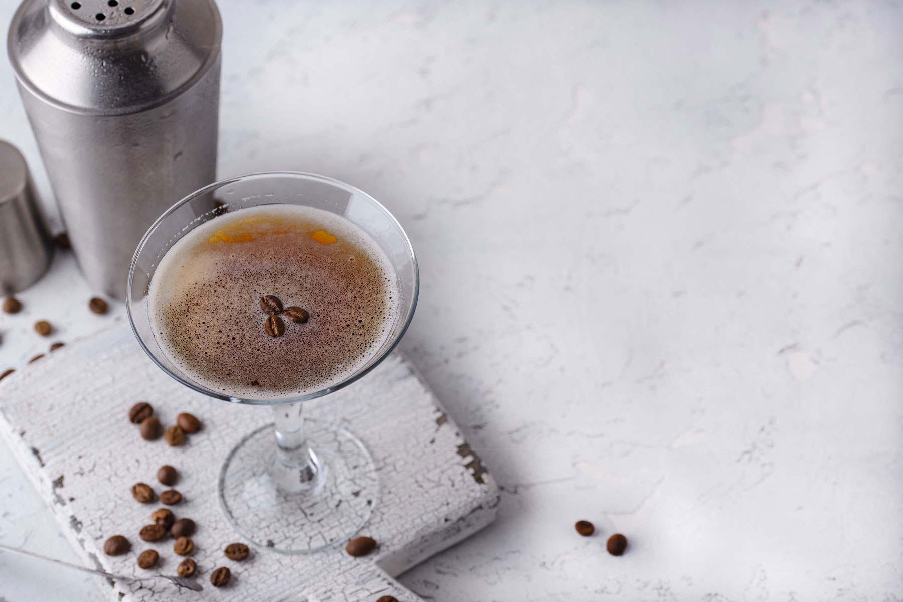 a cup of coffee sitting on top of a white table