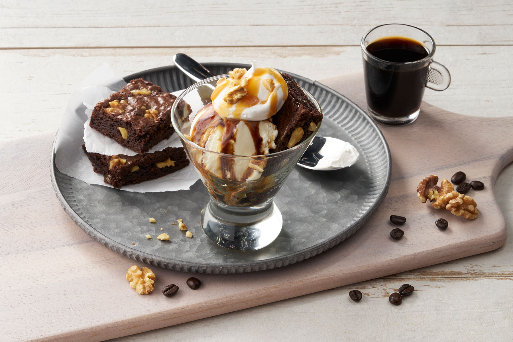 A tray with a delicious dessert and a steaming cup of coffee