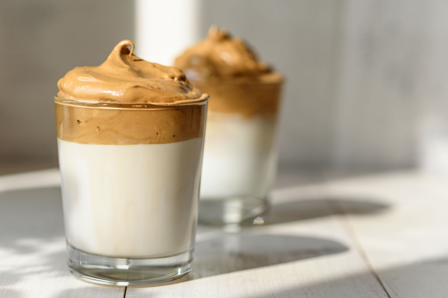 A couple of glasses of food on a table