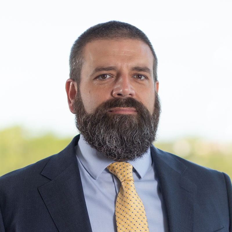 man with a beard wearing a suit and tie